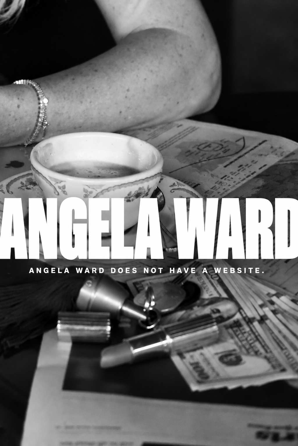 Angela Ward. Angela Ward does not have a website. Black-and-white photograph of a coffee cup, an arm, and objects on a table.